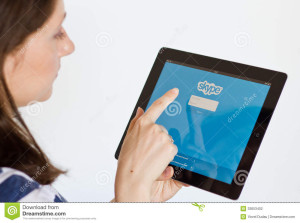 skype-woman-logs-free-communications-network-digital-tablet-33653402